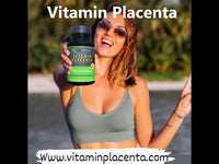 Vitamin Placenta supplement bottle held by a smiling woman outdoors near water. Promotes anti-aging, skin health, and energy for men and women.